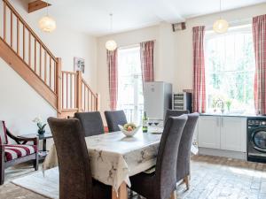 a dining room with a table and chairs at The Amherst House in Bury Saint Edmunds