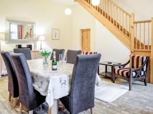 a dining room with a table and chairs at The Amherst House in Bury Saint Edmunds