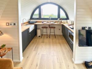 an open kitchen with a sink and a window at Oak Tree Retreat in Dronfield +14 photos