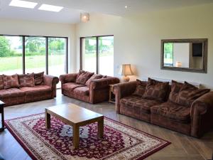 a living room with couches and a coffee table at The Farmhouse - Ukc6250 in Linlithgow