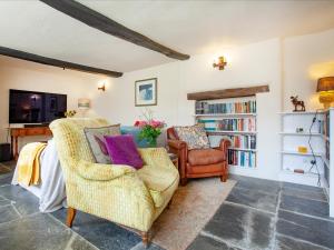 a living room with a couch and two chairs at The North Wing - Ukc6794 in Saint Gennys