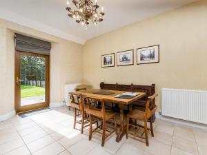 a dining room with a table and chairs at The Servant's Hall - Ukc6964 in Carnoustie