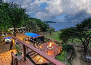 an overhead view of a deck with a fire on it at Malkoha Lake St Lucia in Hluhluwe
