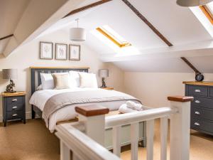 a bedroom with a bed and a skylight at Symond House-Ukc5530 in Bury Saint Edmunds +5 photos
