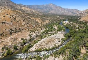 an aerial view of a river with mountains in the background at Riverkern Retreat House in Kernville