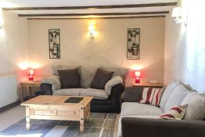 a living room with two couches and a coffee table at Fistral Cottage - Cwc46839 in Perranporth