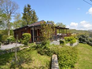 a house with a garden in front of it at Comfortable chalet in PetitHan with garden in Durbuy