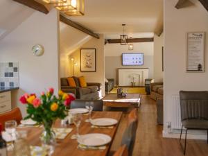 a living room with a table and a couch at Number One - Ukc4963 in Tawstock
