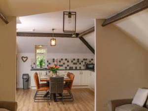 a kitchen and dining room with a table and chairs at Number One - Ukc4963 in Tawstock +29 photos