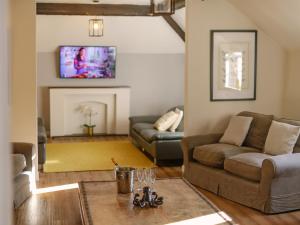 a living room with two couches and a tv at Number One - Ukc4963 in Tawstock