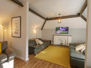 a living room with two couches and a fireplace at Number One - Ukc4963 in Tawstock