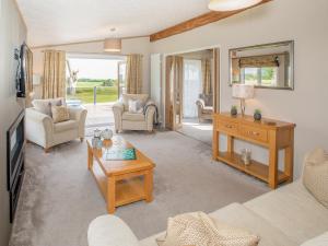 a living room with a couch and a table at Rivendale in St. Andrews