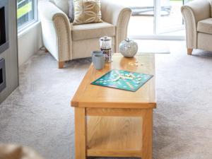 a wooden coffee table in a living room at Rivendale in St. Andrews