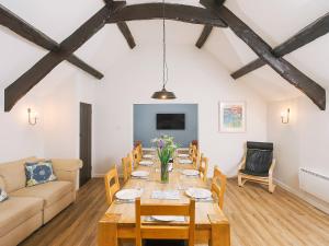 a dining room with a long table and chairs at Number Six - Ukc4968 in Tawstock
