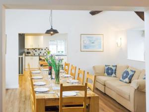 a dining room and living room with a table and chairs at Number Six - Ukc4968 in Tawstock