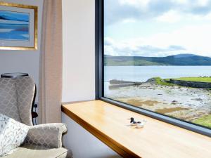 a window with a view of a body of water at Dunmore Villa-Uk36498 in Tarbert
