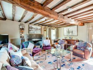 a living room with a couch and a table at Croxton Park House in Croxton Kerrial
