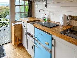 a kitchen with a sink and a counter top at Castle Lodge - Uk50987 in Sheriff Hutton