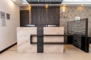 a lobby with a reception desk in a building at Wyndham Garden Quito in Quito
