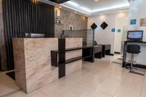 a lobby of a salon with a reception desk at Wyndham Garden Quito in Quito