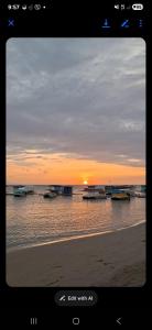 a view of a beach with boats in the water at ShaChi Beach House in Lian