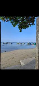 a view of a beach with boats in the water at ShaChi Beach House in Lian