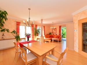 a dining room with a wooden table and chairs at Apartment near the river in Deggendorf Bavaria in Deggendorf
