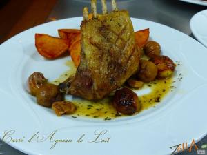 a plate of food with a piece of meat and potatoes at Maison d'Hôtes Zella in Bains de Guitera