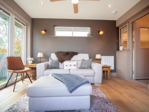 a living room with a couch and a chair at Dalmore-Ukc5067 in Aviemore