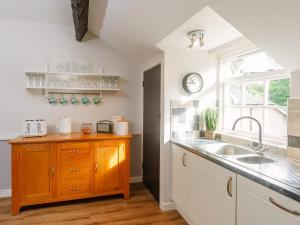 a kitchen with a sink and a window at Number Three - Ukc4965 in Tawstock