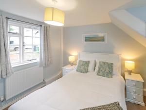 a bedroom with a white bed and a window at Number Three - Ukc4965 in Tawstock