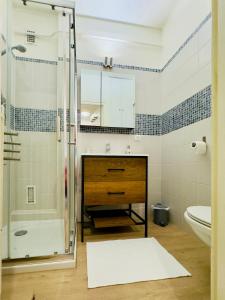 a bathroom with a shower and a sink and a toilet at L'escale Annécienne in Annecy +15 photos