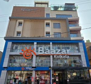 a large building with a sign in front of it at The Bansara Royal in Kātoya