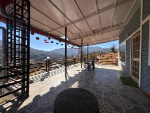 a view from the balcony of a house at Mountview guest house in Mukteshwar