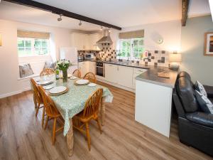 a kitchen and dining room with a table and chairs at Number Eight - Ukc4971 in Tawstock