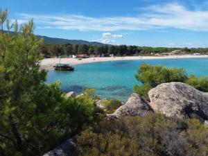a view of a beach with a boat in the water at Haus Despina in Sarti