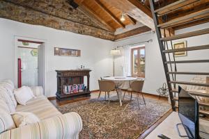 a living room with a couch and a table at Agriturismo Tripala in Minucciano