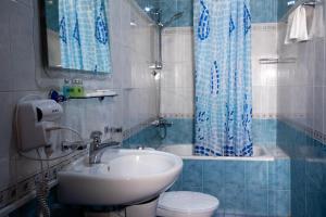 a bathroom with a sink and a toilet and a shower at Casanova Inn - Boutique Hotel in Dilijan +140 photos