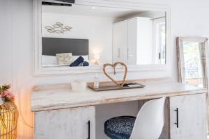 a room with a table and a mirror at Huis Marais in Herolds Bay +53 photos
