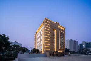 a building with a sign on the side of it at Foxtrail Sector 60 - AM Hotel Kollection, Gurgaon in Gurgaon