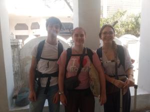 a group of three people standing next to each other at OP krishna homestay in Mathura +2 photos