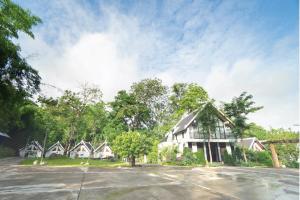 a row of houses in a residential neighborhood at Lao Asia Resort Luangprabang in Luang Prabang