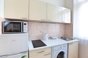 Kuchyň nebo kuchyňský kout v ubytování Angel City Aparthotel