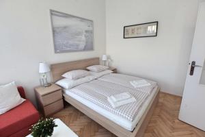 Postel nebo postele na pokoji v ubytování Angel City Aparthotel