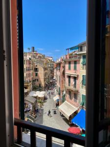 a view of a city street from a window at EvasRooms Open space in Vernazza
