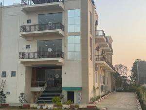 a building with stairs and balconies on it at Agastya Resort in Bāri