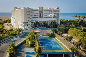 an aerial view of a resort with a swimming pool at NissiBlu Beach Resort in Ayia Napa