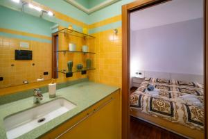 a bathroom with a sink and a bed at PROMENADE Luxury View in Sarnico +20 photos