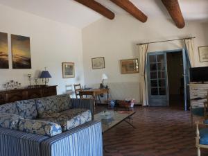 a living room with a couch and a table at Charming Holiday Home in Tourtour, Provence with Garden in Tourtour