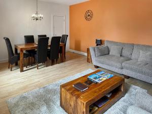 a living room with a couch and a table at Moat House 6 - Ukc4889 in Fort Augustus